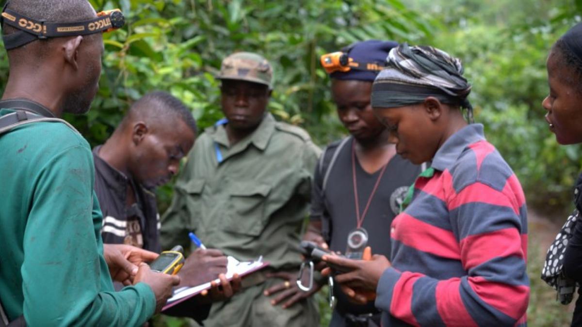 Community ecoguards, Felecia Kyne (left) and Mathaline Garley (right), improve their GPS skills during their first field mission in Grebo-Krahn National Park in April 2018