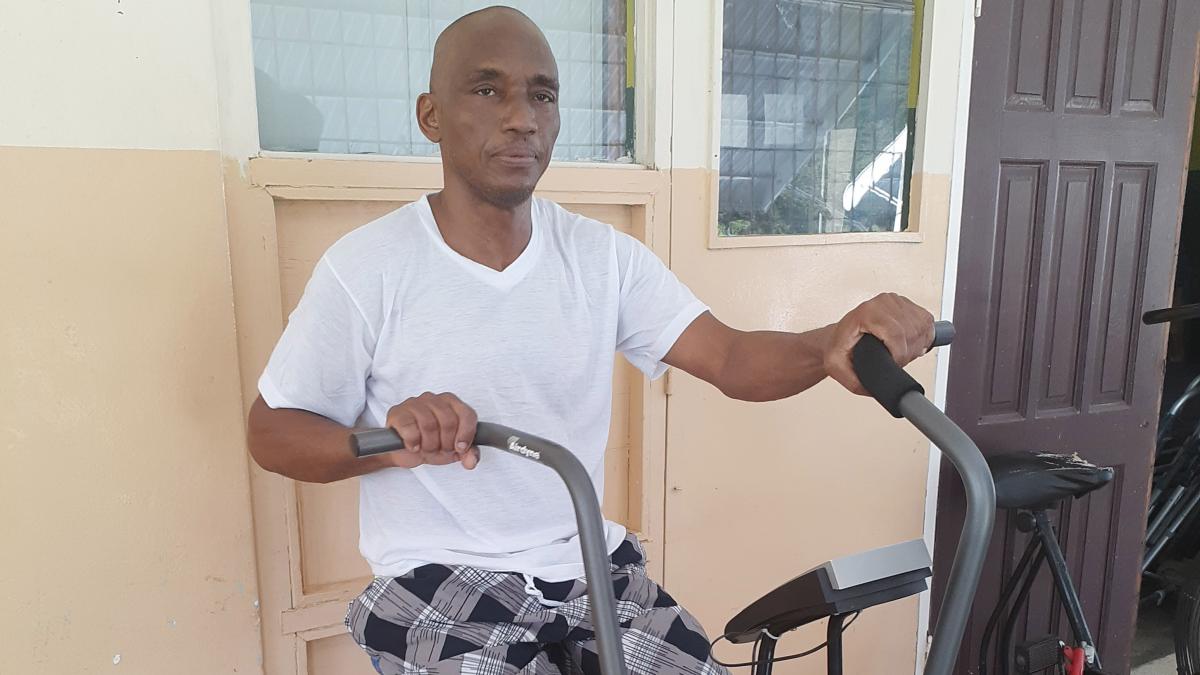 A patient at a rehabilitation center in Jamaica using an ergometer donated by Food For The Poor in partnership with LEPP.