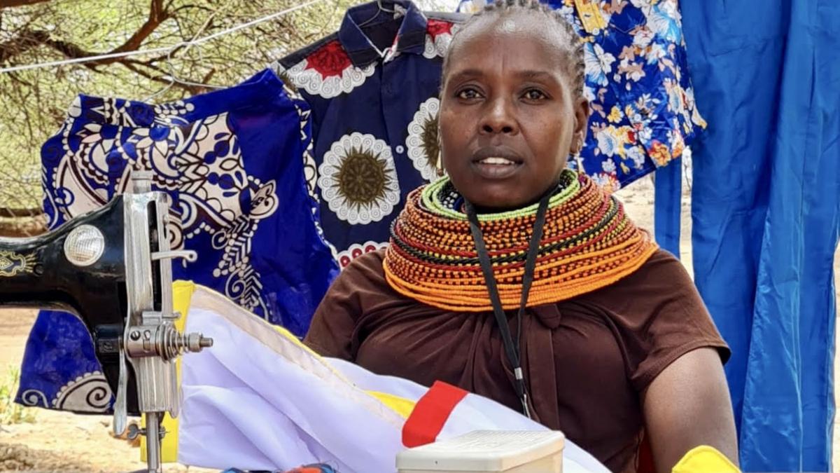 Jane Asimit launched her own seamstress business from home after receiving USAID-supported vocational training and a sewing machine. It has since grown into a successful local shop training young women. Photo: Norin Walimohamed/USAID
