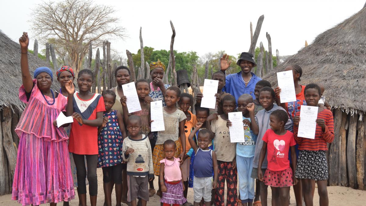 Namibian children holding their newly acquired birth certificates 