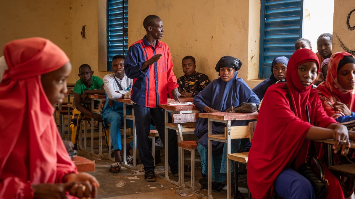 A teacher talks about community violence during class at a school supported by NAGARI NGO through CREATIVE/USAID in Zinder, Niger on June 8, 2023.