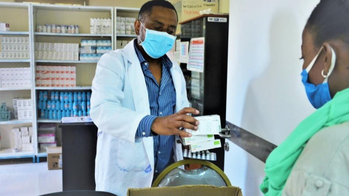 A pharmacist dispensing HIV medicine to a patient by using the appointment spacing model in Adama Hospital Medical College, Adama town, Oromia regional state, Ethiopia.