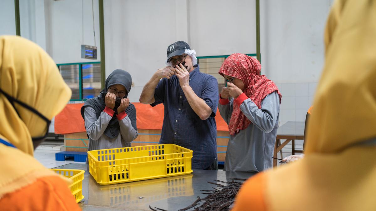 Sam Filiaci, senior vice president of Cooperative Business International (CBI) for Southeast Asia, walks around the spice factory he operates with Eko Rahayu Sutanti, factory manager, and Uning Imbi Purnaning Dewandari, deputy factory manager.