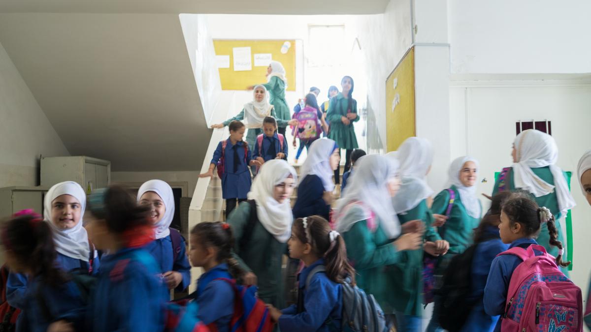 Students in a busy school hallway.