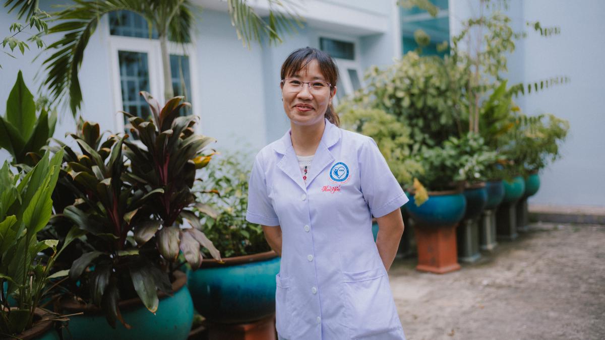 Dr. Thai Thi Hai Yen in the garden at Dĩ An City Hospital in Vietnam.