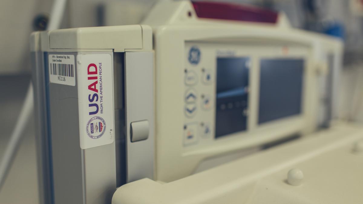 The USAID logo appears on some equipment