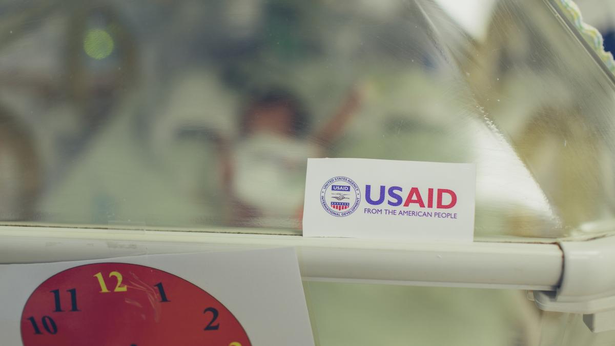 The USAID logo appears on equipment in the NICU