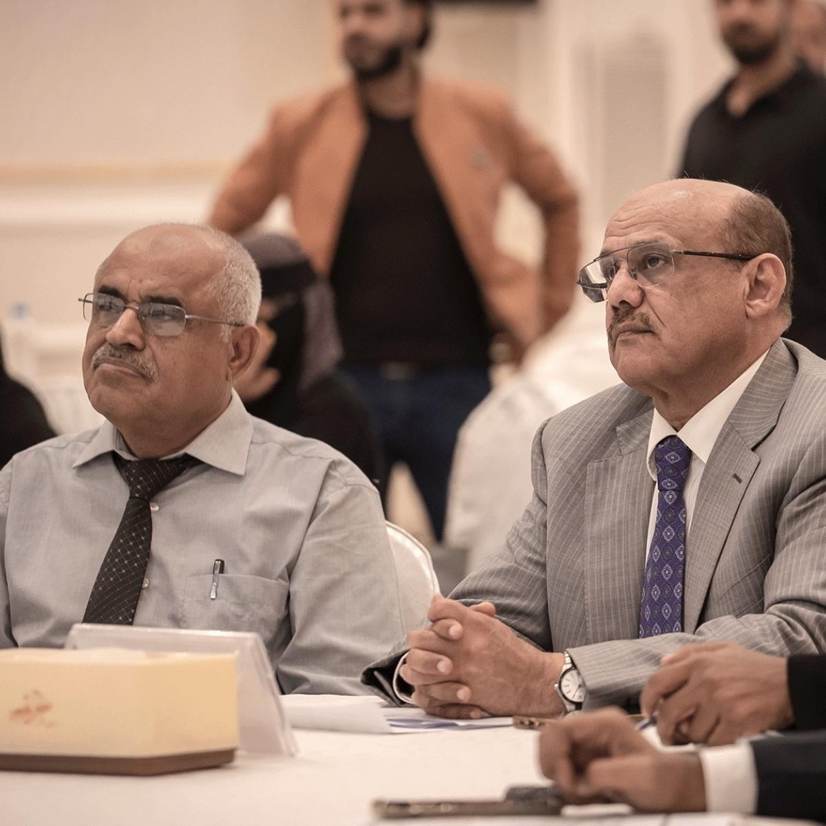 Central Bank of Yemen Governor, H.E. Mr. Ahmed Ghaleb Al-Maabqi, right, listens a presentation of the new communications strategy for greater transparency.
