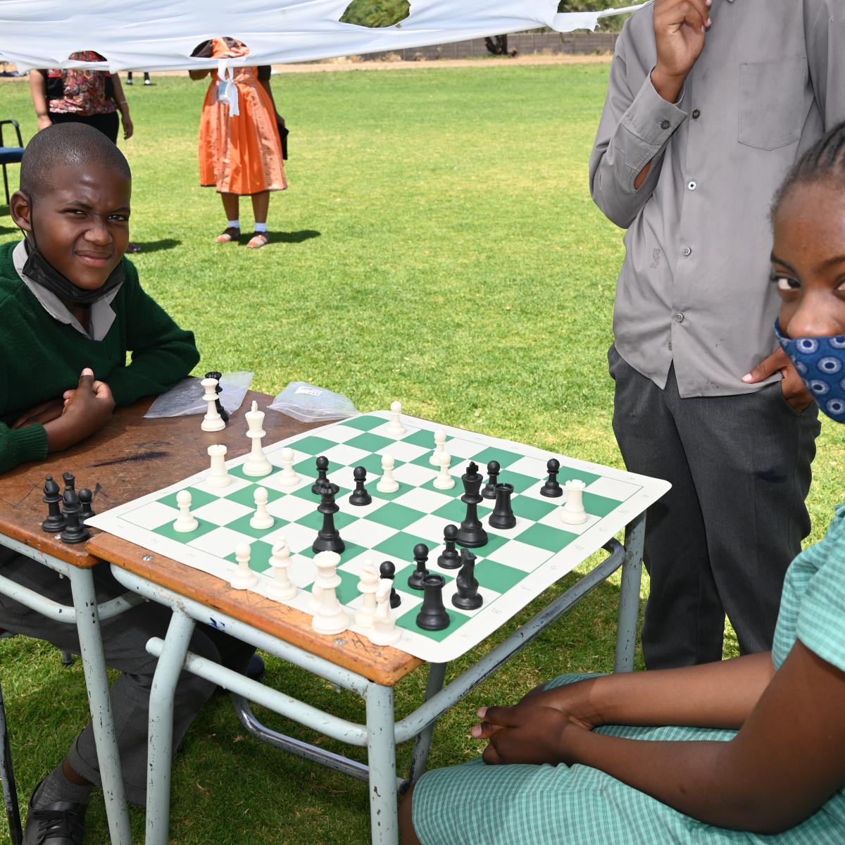 Seven-graders Josef Iifo and Yassira Princess Ndapopilwa are battling it out in a match with one of the donated chess boards.
