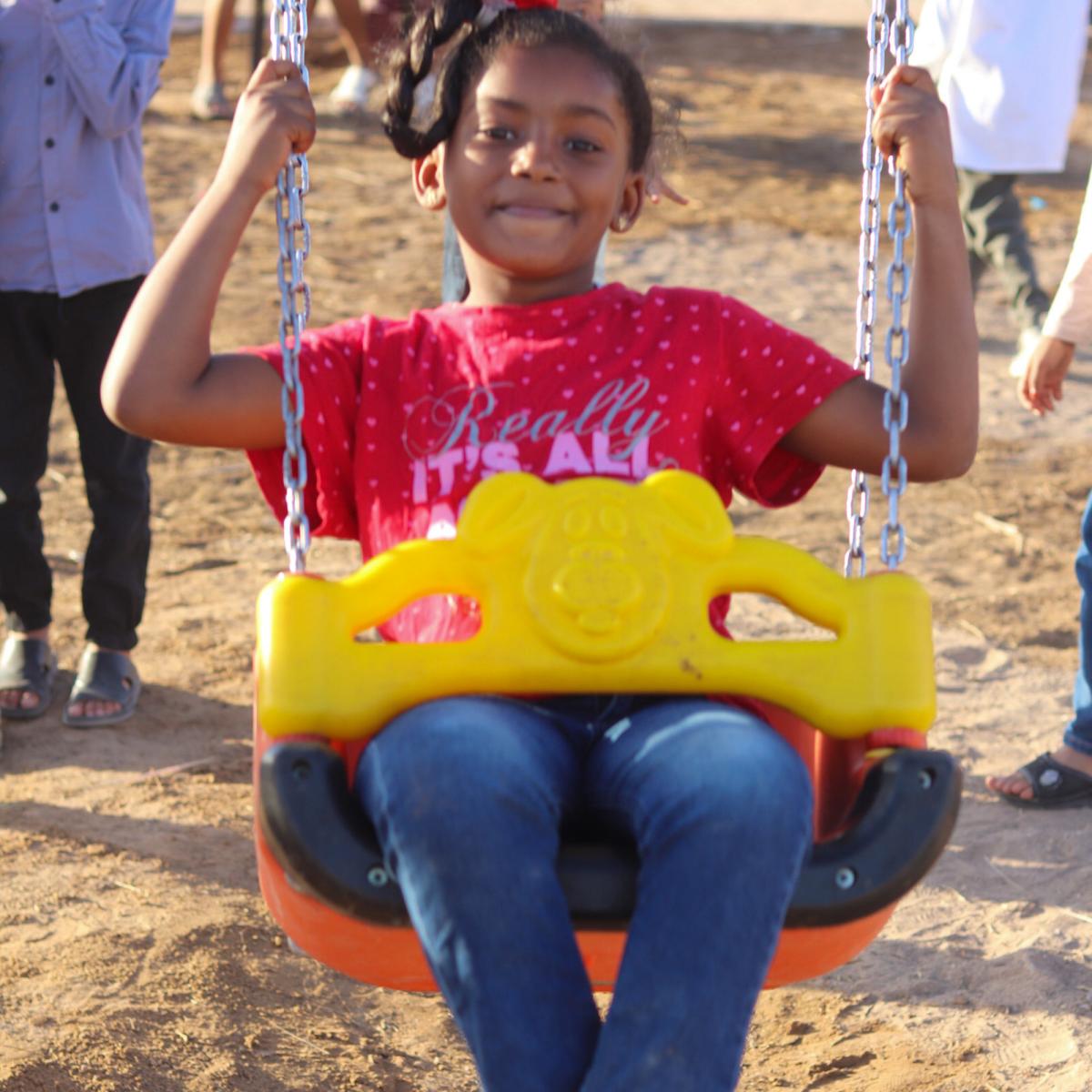 Children enjoying the new playground in Ghadamis, Libya