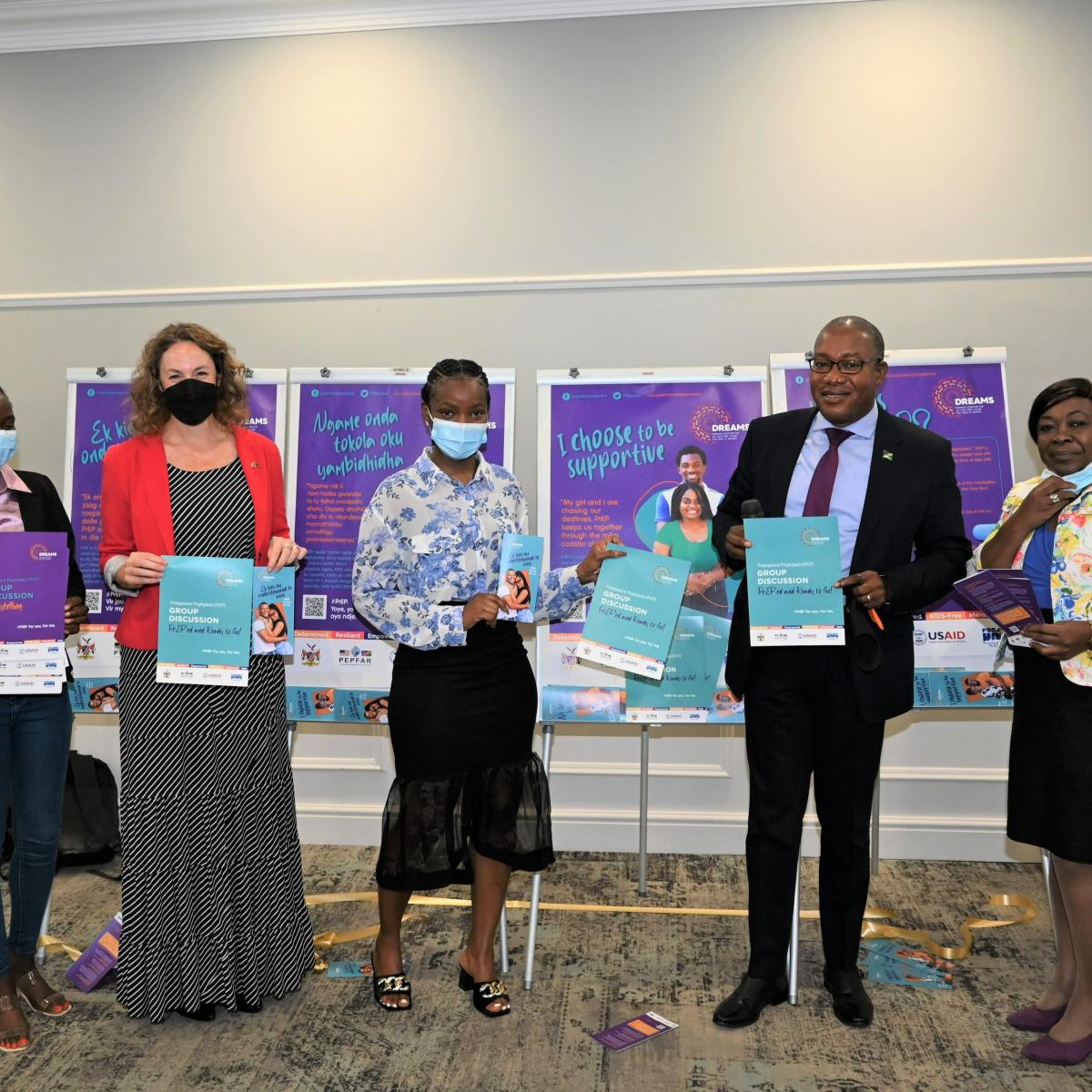 Presenting the new PrEP public awareness posters and flyers (from left to right): Johanna Shinana (DREAMS Ambassador), Nicole Miller (DREAMS Coordinator, USAID), Adelheid Gowases (DREAMS Ambassador), Ben Nangombe (Executive Director, MOHSS), Rosalia Indongo (Project Hope, Country Director), Bernadette Harases (DREAMS Chief of Party).