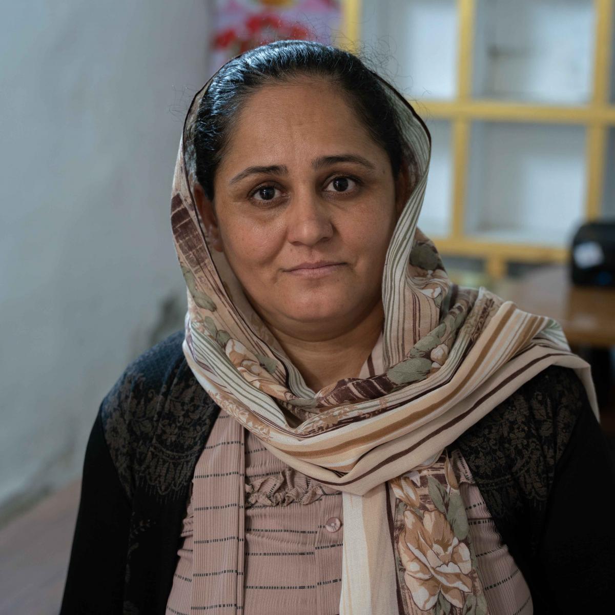 Nadia, 43, has opened her own homemade Iraqi pastry shop with support from USAID.