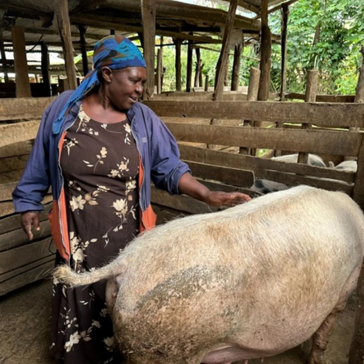 Farmer with her pig. 