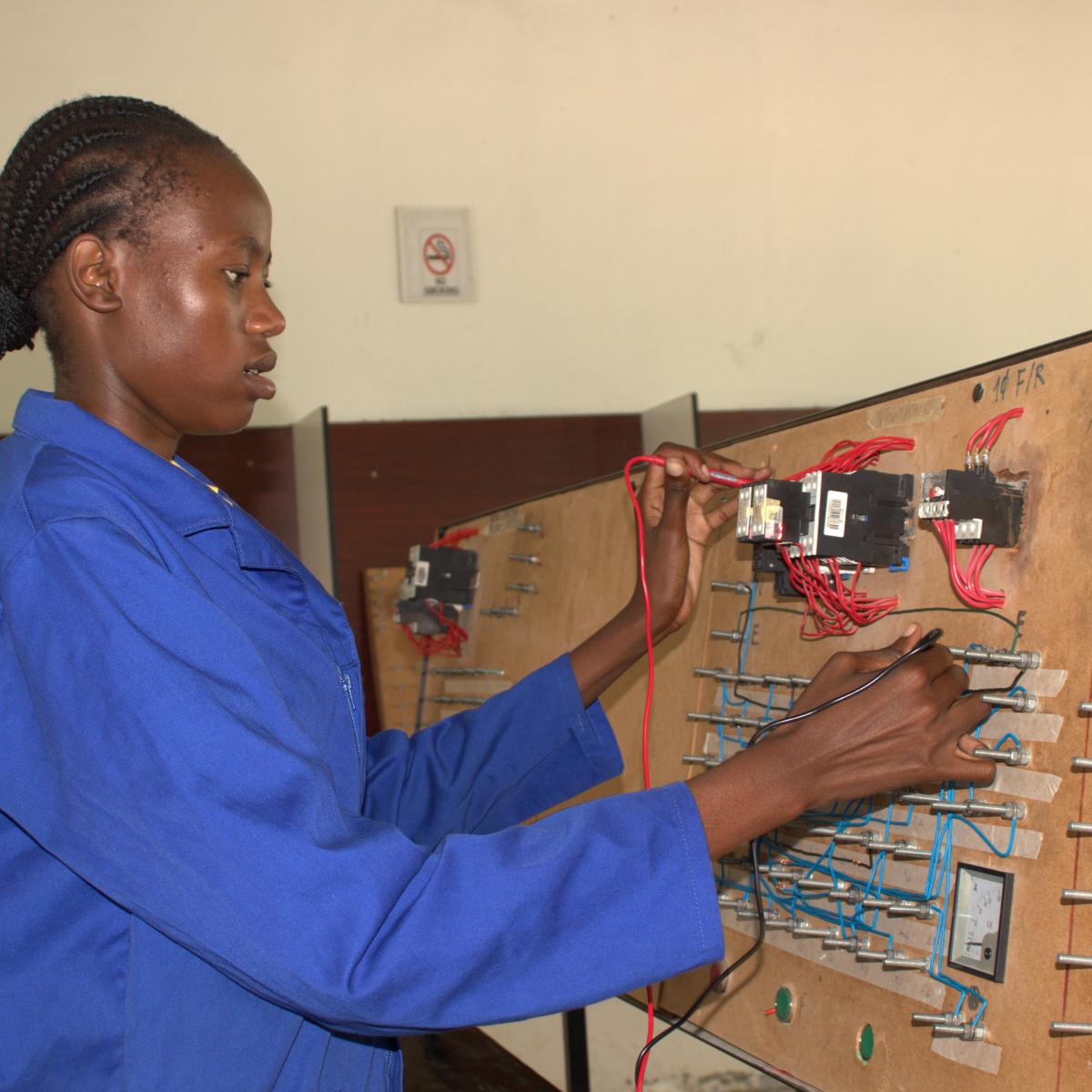 Rempie Jeremia practices her electrical skills as she prepares to enroll for Level 2 of her vocational training through the Namibia Training Authority.