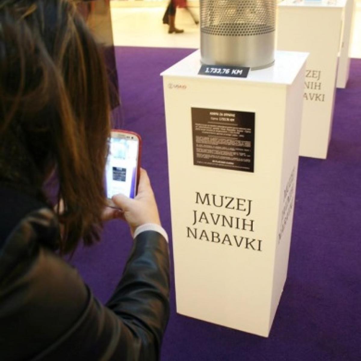  Citizen takes photos of $938 wastebasket bought by government, during "We Pay the Price" campaign in Sarajevo.