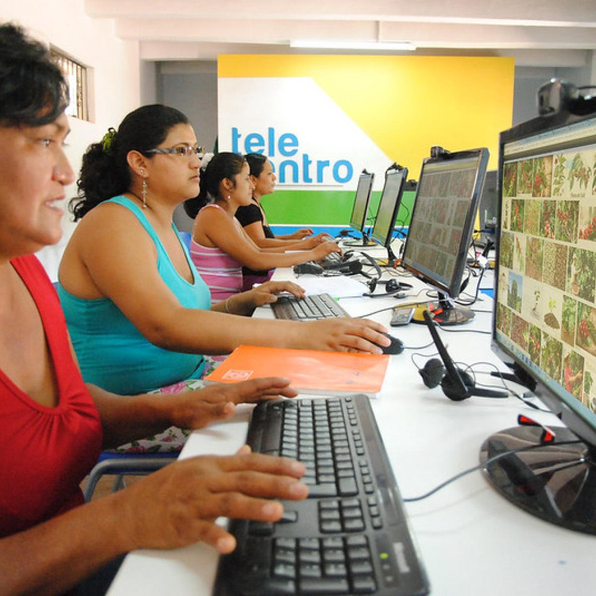 Women from rural area using computers in the telecentres implemented by Cr3ce Alliance