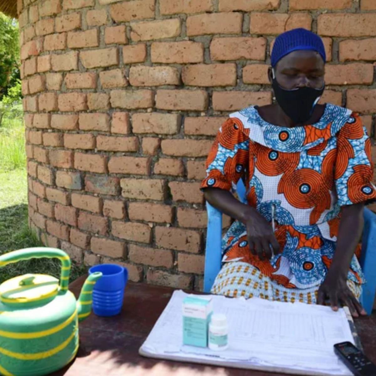 Dradere Joyce Alaru, a community drug distributor, provides treatment for river blindness in her community. / Aggrey Mugisha, The Carter Center