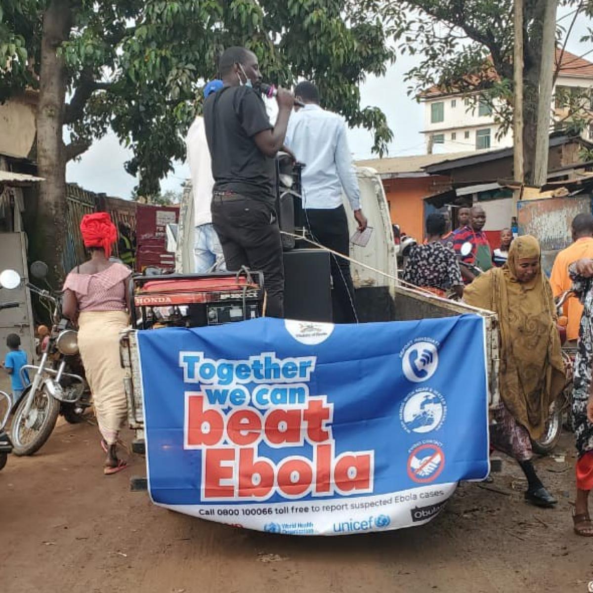 A community resource person sensitizes a community in Kampala about Ebola. / JHU -SBCA