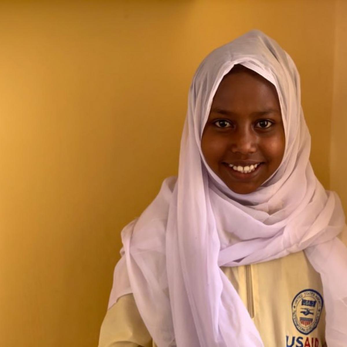 Fatma, 13, has been able to return to school through USAID assistance.