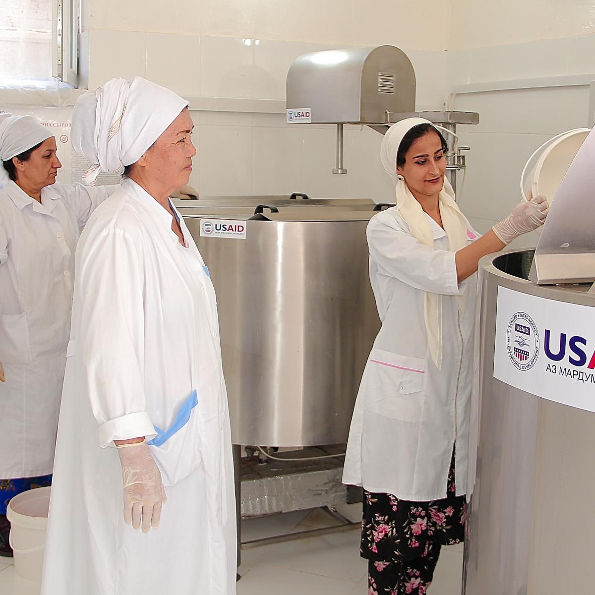 Uguloy Abdullaeva with milk analysis specialist in her dairy processing facility equipped by the USAID/ACAT. Balkhi district, June 2022.