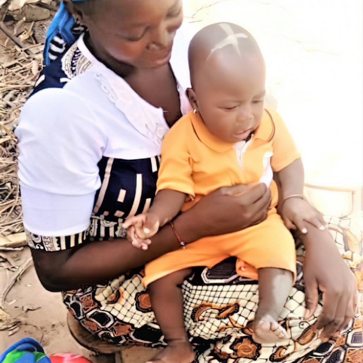 Mariam Coulibaly cares for her young child
