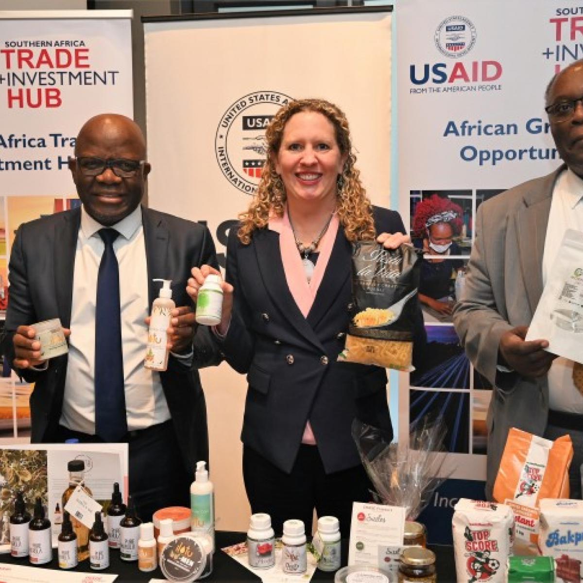 Executive Director of the Ministry of Industrialization and Trade, Sikongo Haihambo, Chargé d’Affaires of the U.S. Embassy Jessica Long, and USAID Country Representative Dr. McDonald Homer presenting products of Namibian companies that are supported by the USAID TradeHub program.