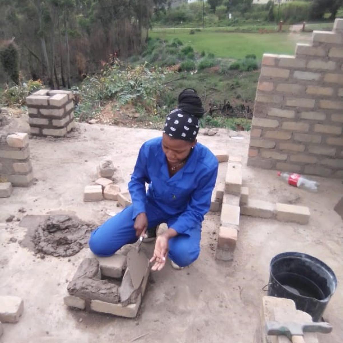 Pheladi working on a construction site