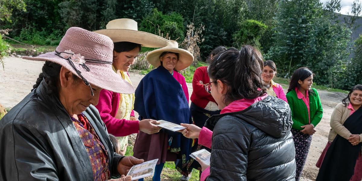 A group of women in an Andean community learning about the distribution of the revenue from mining industries in their region.