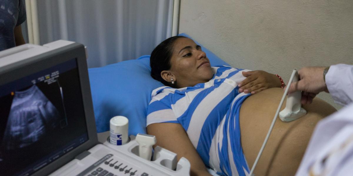 Pregnant woman having an ultrasound of her belly.