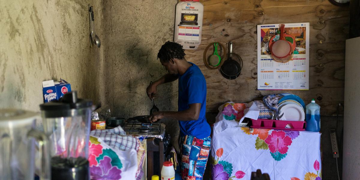 Ruben cooks a meal for his daughter in his home.