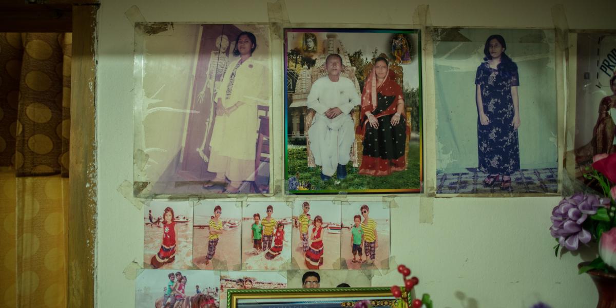 Wall covered with family photos.