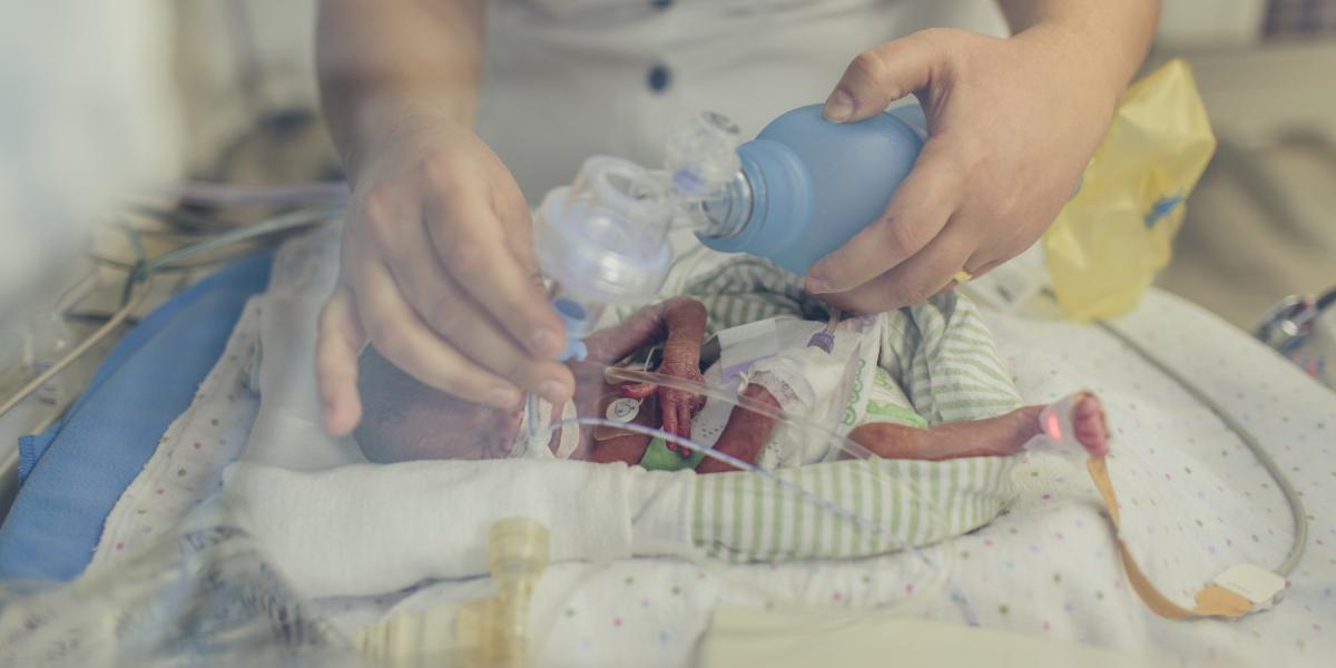 A baby receives oxygen