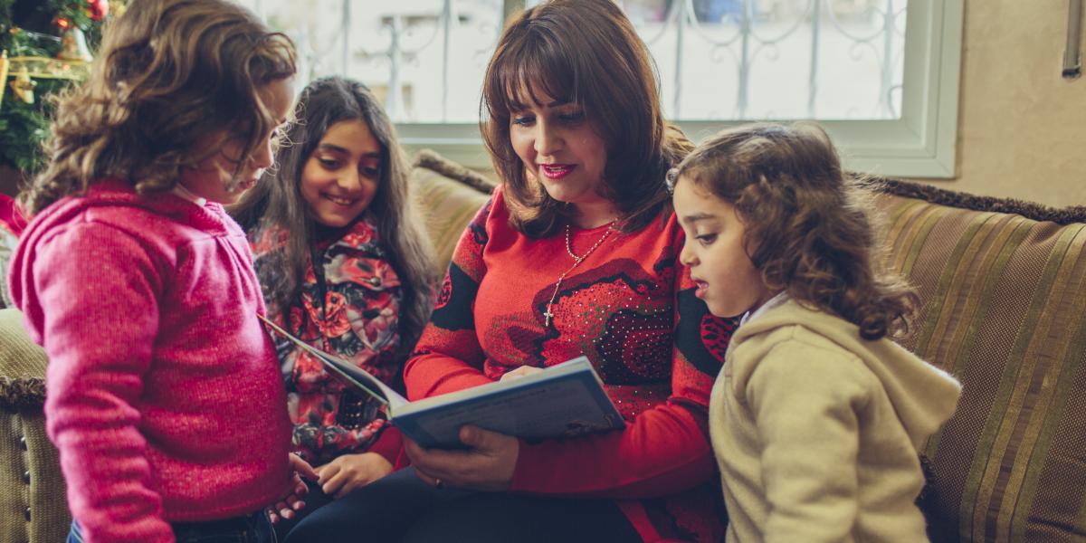 Rula reads to her daughters