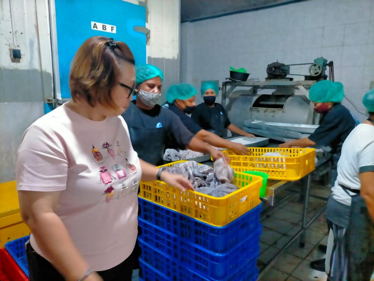 Workers are processing freshly caught seafood