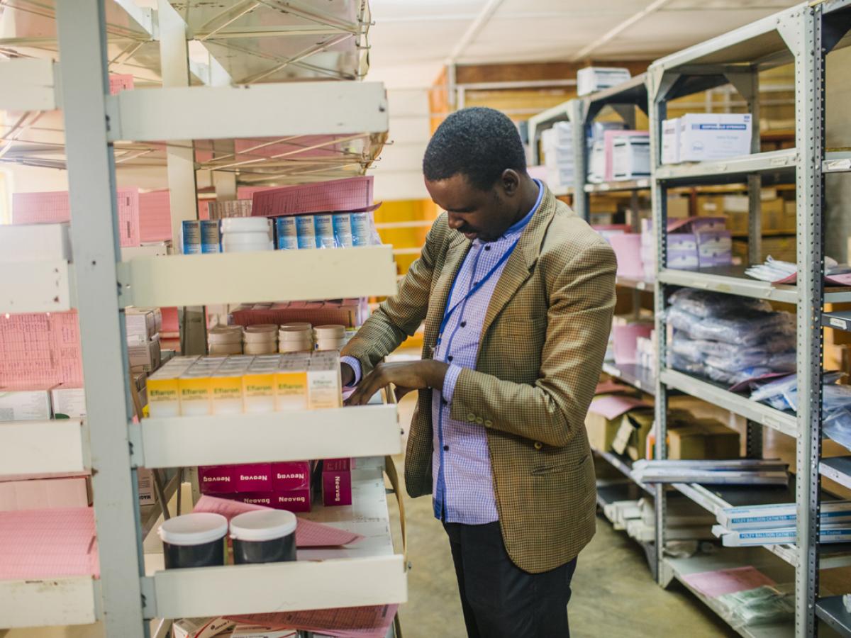 A man organizes inventory in a medical clinic