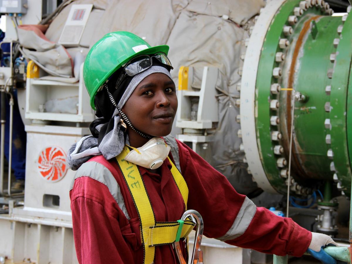 A worker inspects equipment at the Olkaria Geothermal Plant in Kenya. (Photo: Carole Douglis/USAID West Africa)