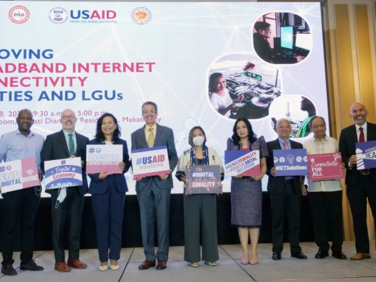 USAID Philippines Mission Director Ryan Washburn (fifth from left), DICT Assistant Secretary Philip Varilla (leftmost), Assistant Secretary Maria Teresa Camba (fourth from left), Makati City Mayor Abby Binay (center), and Tagbilaran City Mayor Jane Yap join other U.S. government representatives