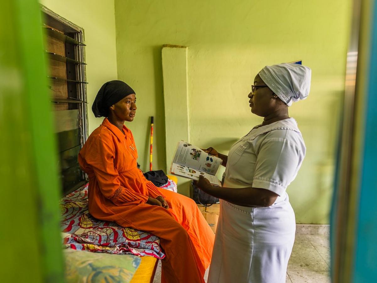 Adama attends a patient at the Tamale Reproductive and Child Health Center in northern Ghana.