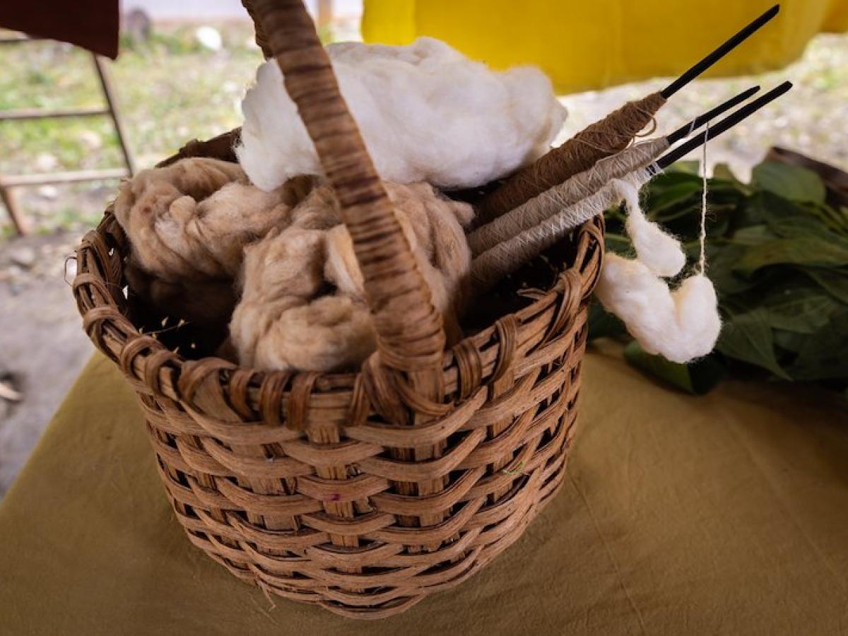 A basket holds some of the wool and materials used by the Yanesha artisans of Peru for their fabrics. 