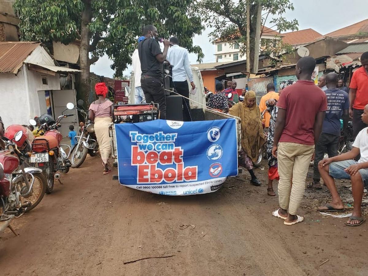 A person providing education about Ebola to a community in Kampala. 