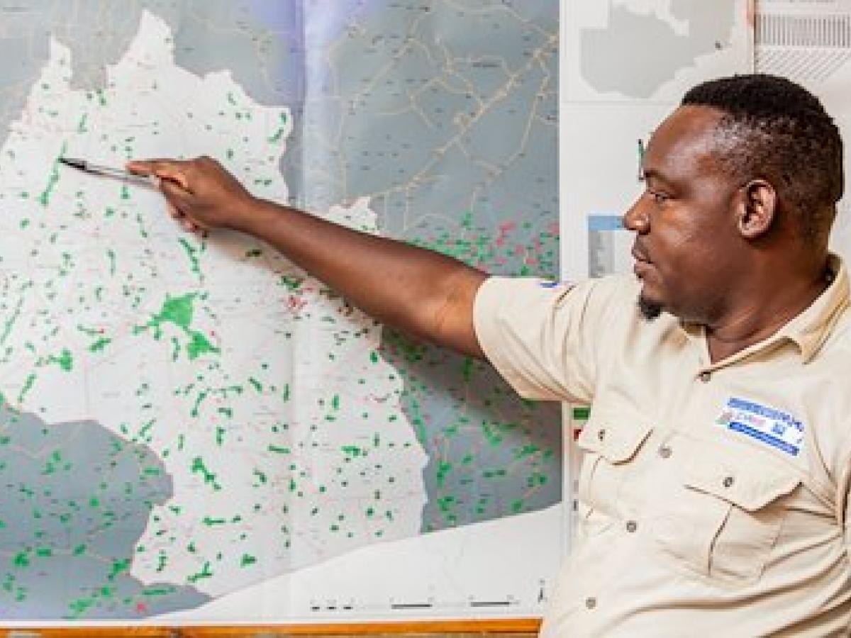 Jerry Maambo points to a map
