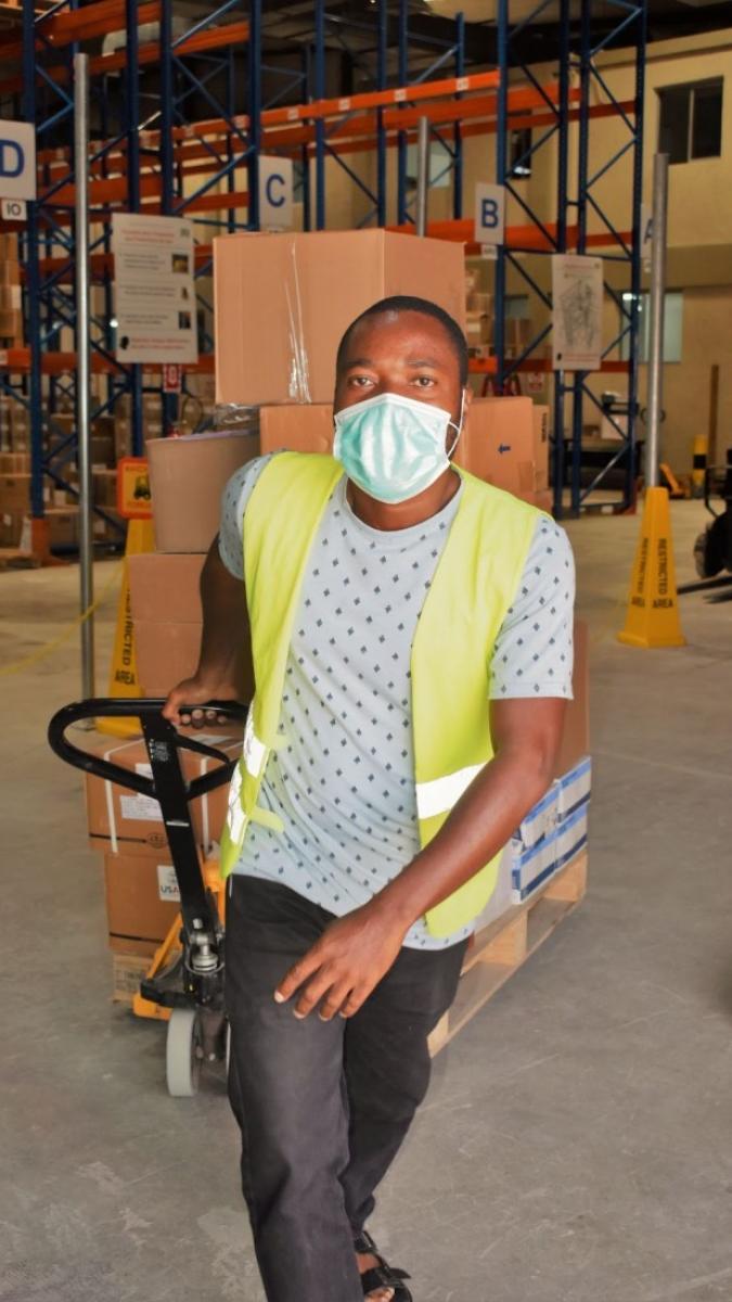 Distribution Officer in a USAID/Global Health Supply Chain-Procurement and Supply Management (GHSC-PSM) warehouse in Haiti.