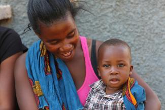 A mother looks at her son during a visit to a health care facility in Kabwe, Zambia.