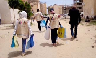 Volunteers distribute hygiene kits in North Sinai to prevent COVID-19. 