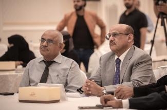 Central Bank of Yemen Governor, H.E. Mr. Ahmed Ghaleb Al-Maabqi, right, listens a presentation of the new communications strategy for greater transparency.