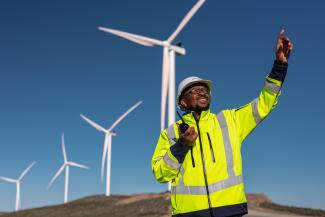 Israel Thothela is the site manager at the Karusa Wind Farm located three hours outside Cape Town, South Africa. Power Africa support to South Africa’s Renewable Energy Independent Power Producer Procurement Program helped the Karusa and Soetwater wind farms reach financial close. Developed by Power Africa partner Enel Green Power, both sites came online in 2022 and are generating a combined 280 MW of clean electricity. Photo credit: Fraser Schenck / USAID Power Africa