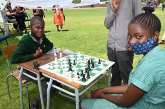 Seven-graders Josef Iifo and Yassira Princess Ndapopilwa are battling it out in a match with one of the donated chess boards.