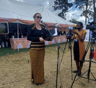 USAID Resident Advisor to the President's Malaria Initiative, speaks at a World Malaria Day event.