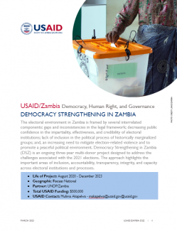 A document with a photo of a woman who is casting a paper ballot in a plastic ballot box.
