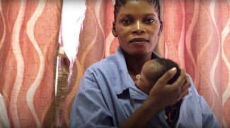 A mother at the USAID-supported Dipeta Health Center demonstrates Kangaroo Mother Care, a simple yet effective practice for ensuring the survival of premature newborns.